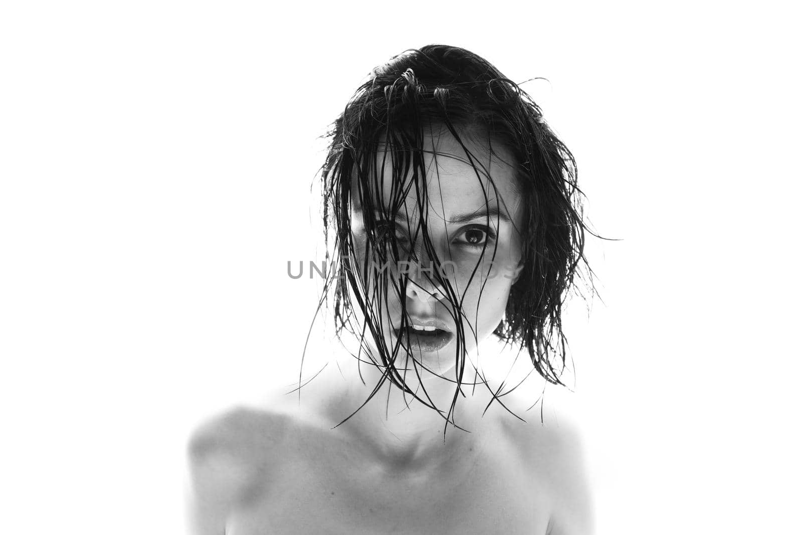 beautiful brunette woman white background, black and white photo by shilovskaya