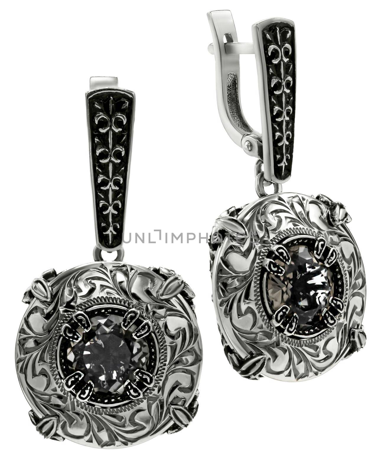 earrings with black stones on the white. High quality photo