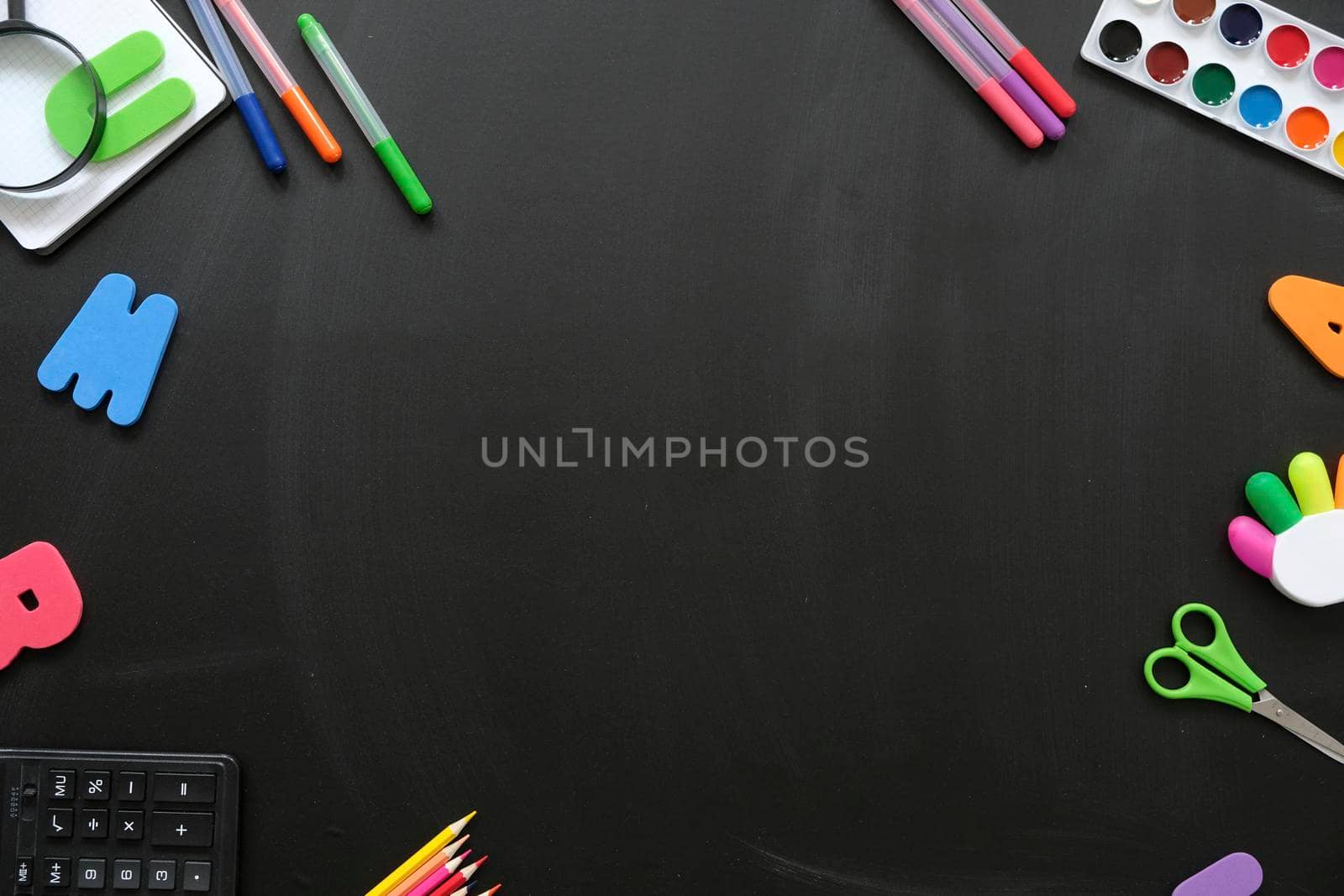 School supplies on black board background, back to school by natus111