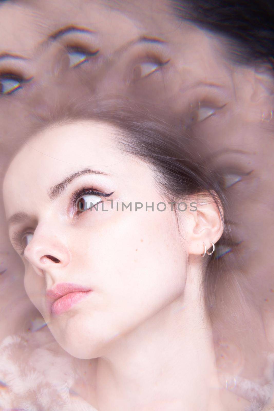 Art portrait, kaleidoscope. Woman in leopard hoodie. High quality photo