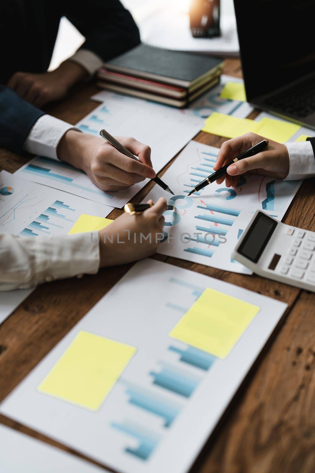 Business casual team are presenting and discussing company growth project success financial statistics, professional investor working start up project for strategy plan with document.