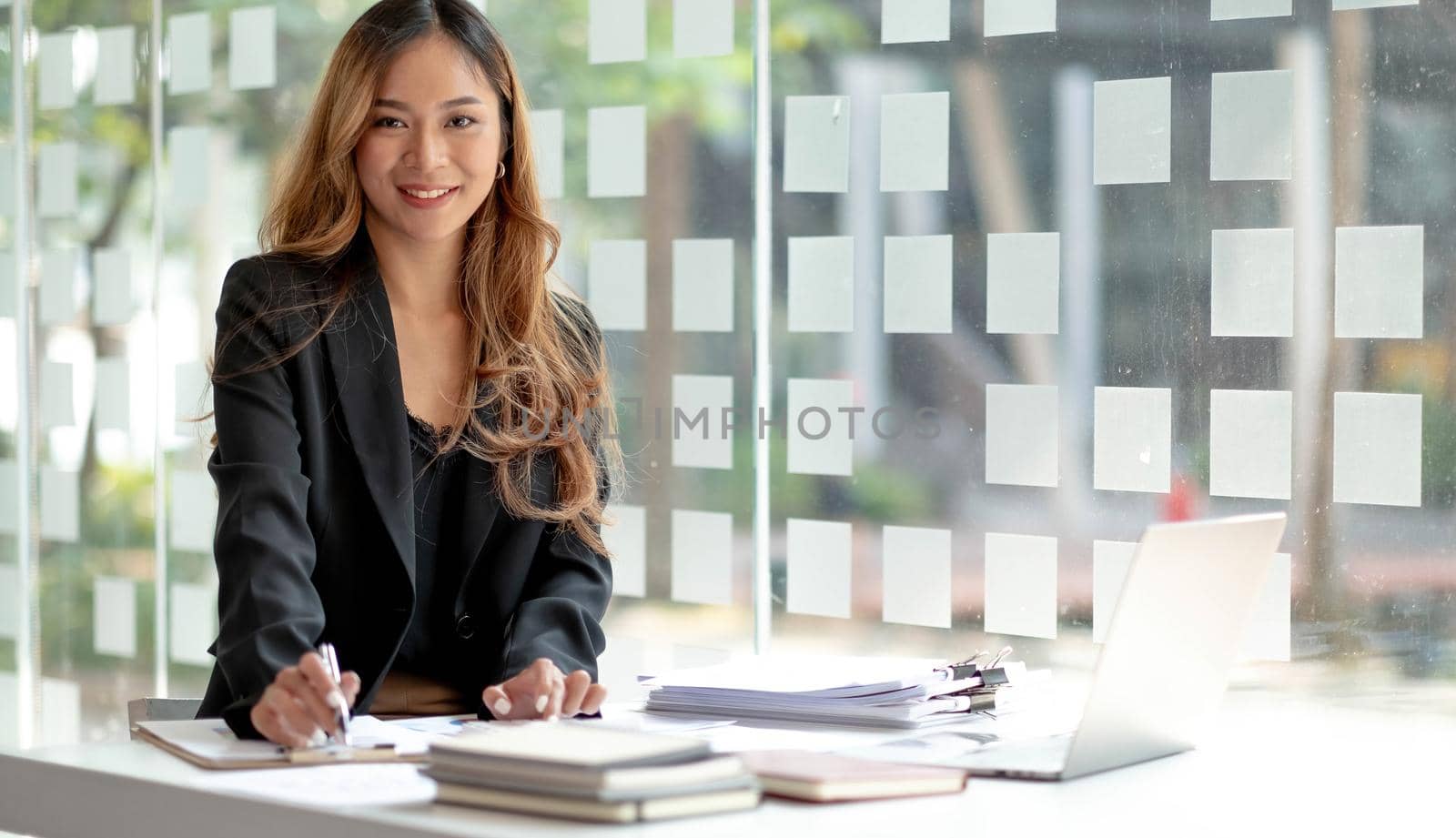 Beautiful asian woman using smartphone, exciting and celebrating with good news of business successful. Small business startup concept..