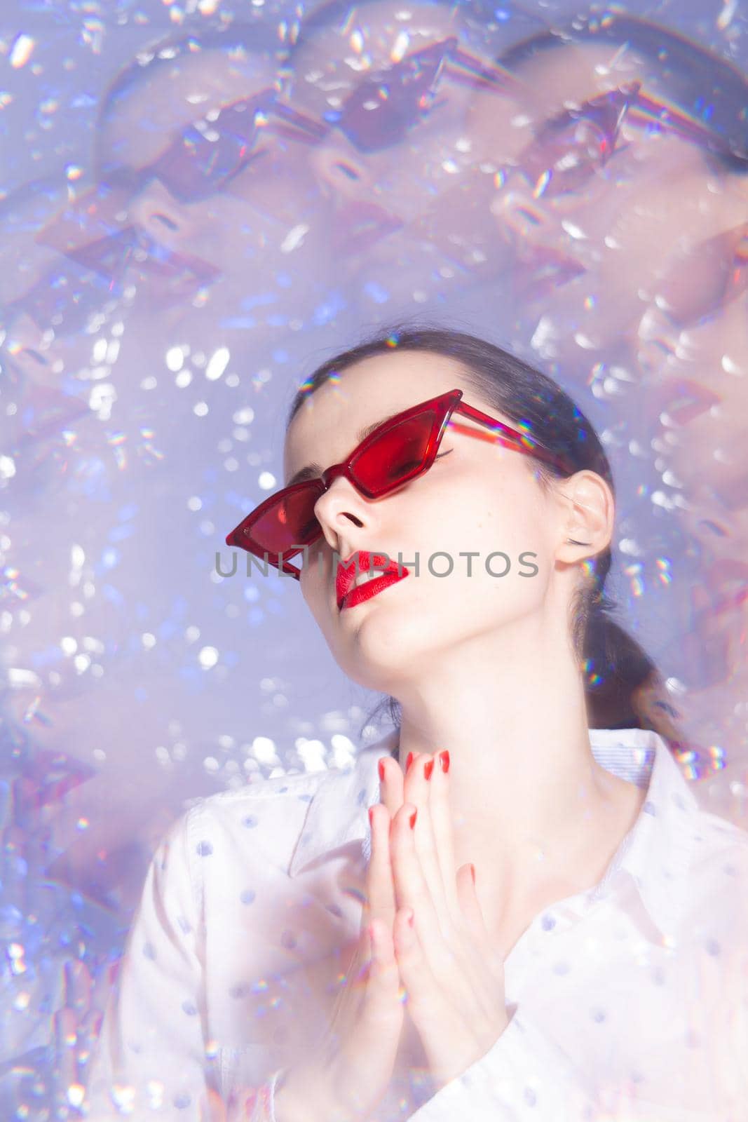 art portrait of a woman in green glasses with red lipstick on her lips in a white shirt by shilovskaya