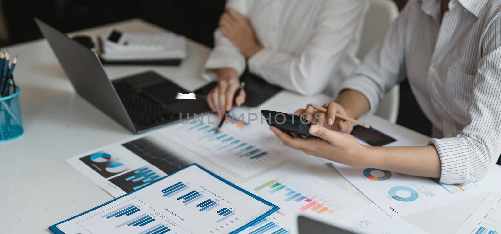 Teamwork of business colleagues, consultation new strategy plan business and market growth on financial document graph report, conference to making growth profit, Partner meetings and briefing.