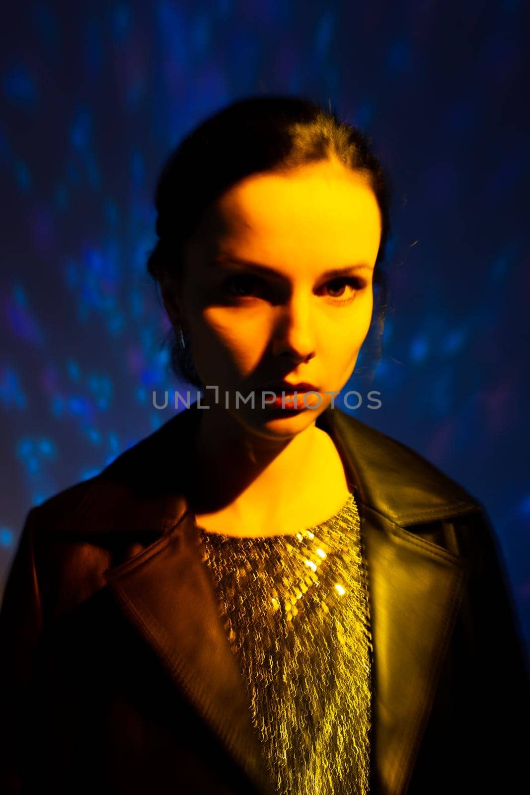 woman with yellow light, colored background, art portrait. High quality photo