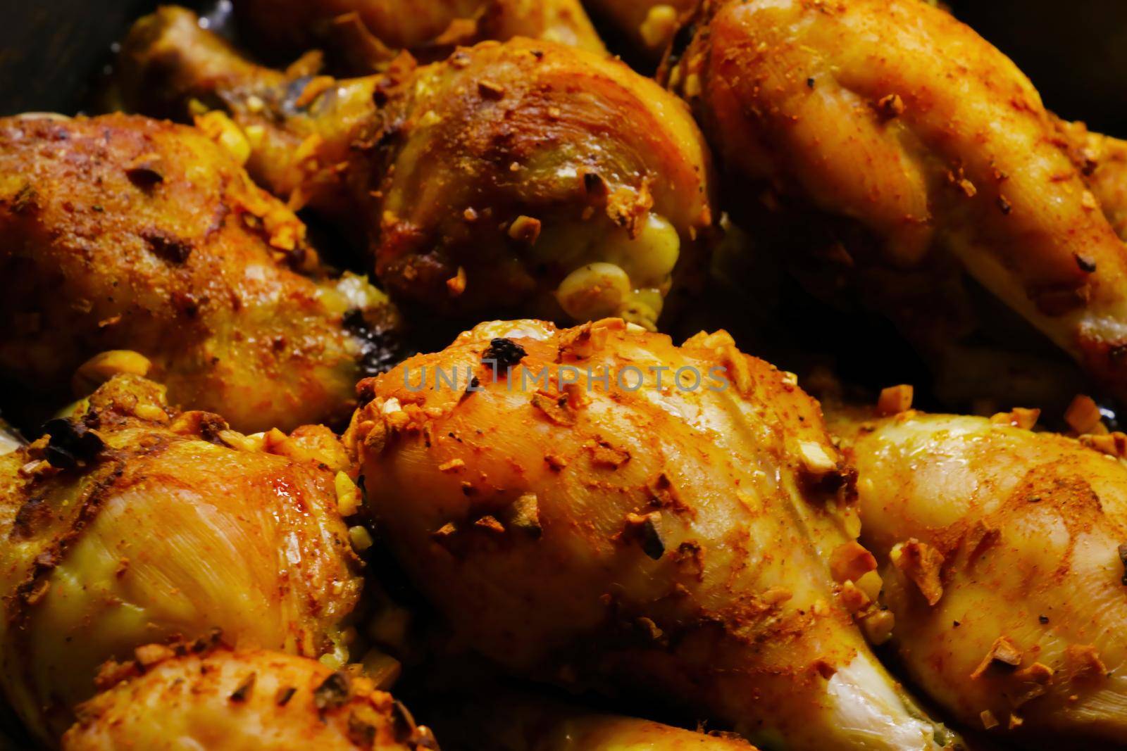 Baked chicken thighs in the oven at home. Out of focus, blurred