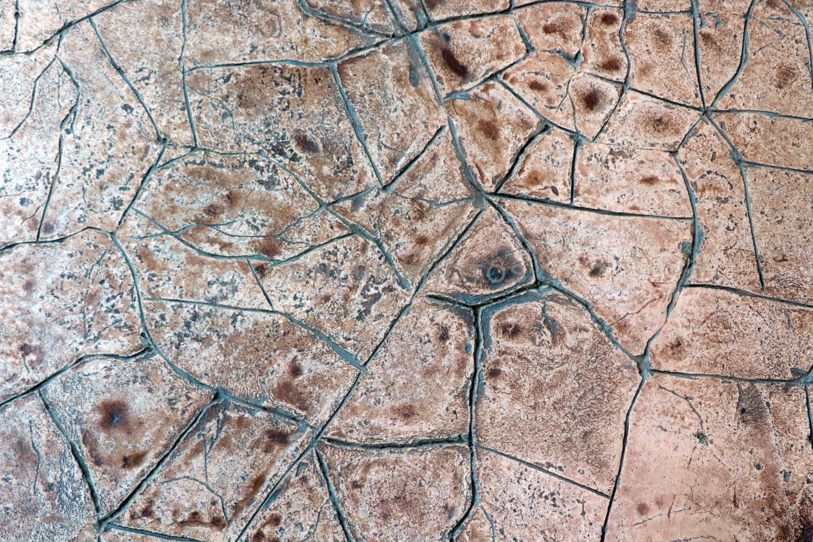 A small wall or floor with cracks. Background, texture of ceramic tiles