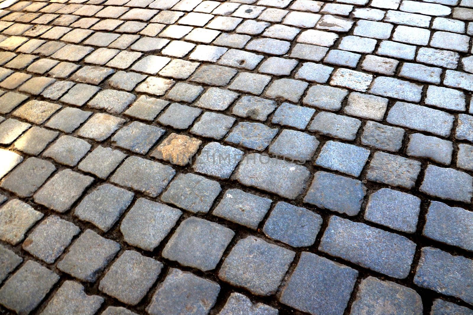 Old paving stones in the old part of the city. Background, out of focus, blurred