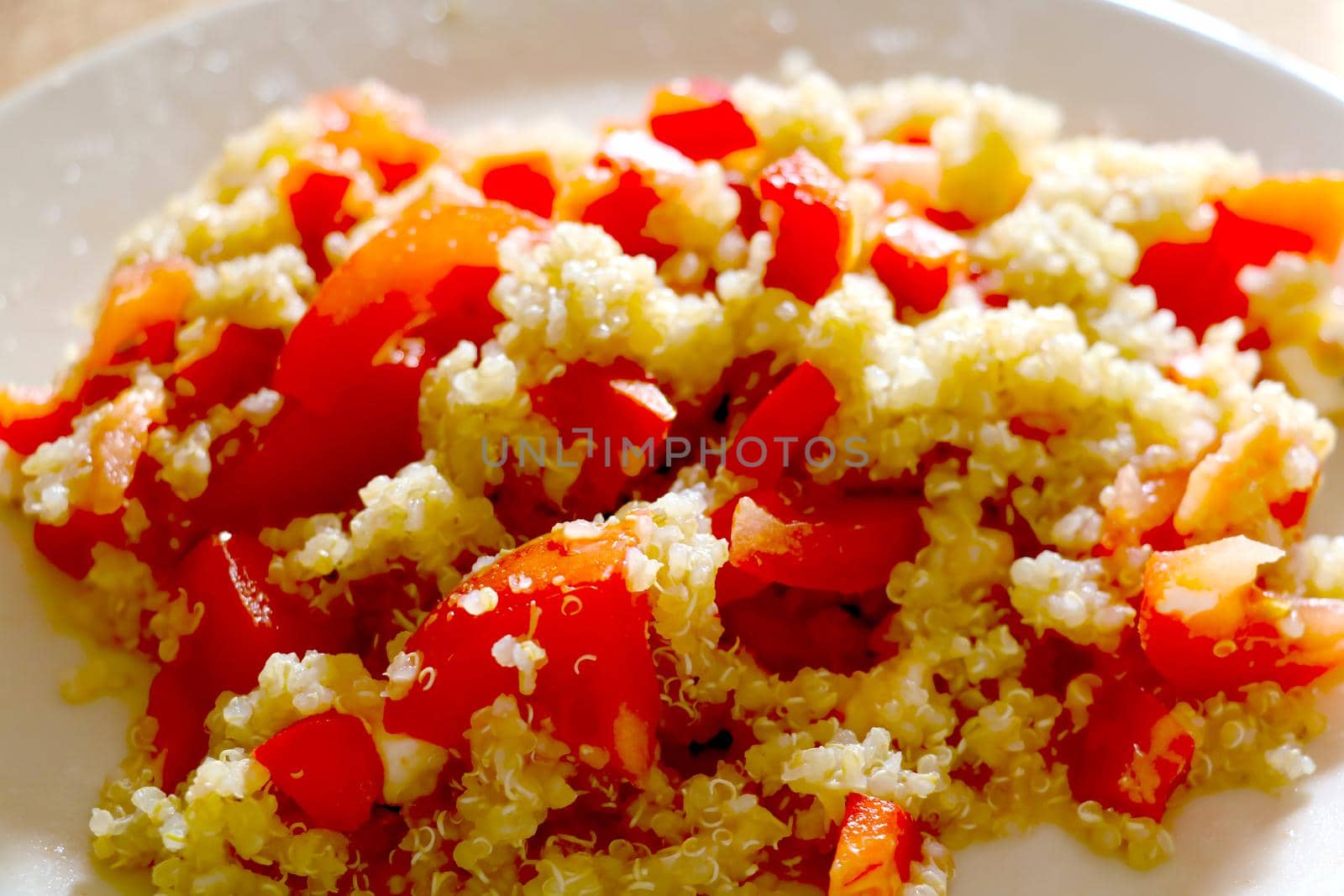 Close-up on healthy light porridge with tomato slices