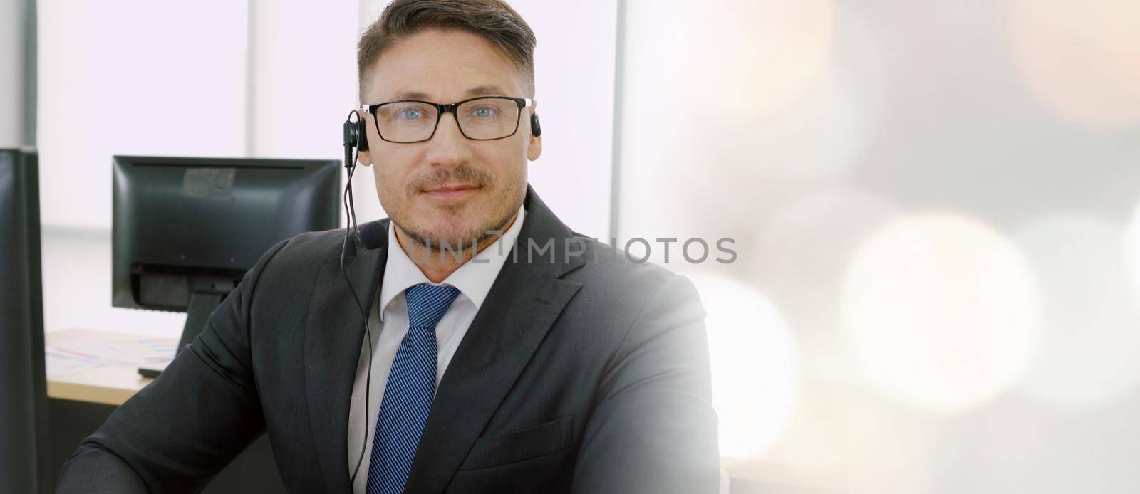 Business people wearing headset working in office broaden view by biancoblue