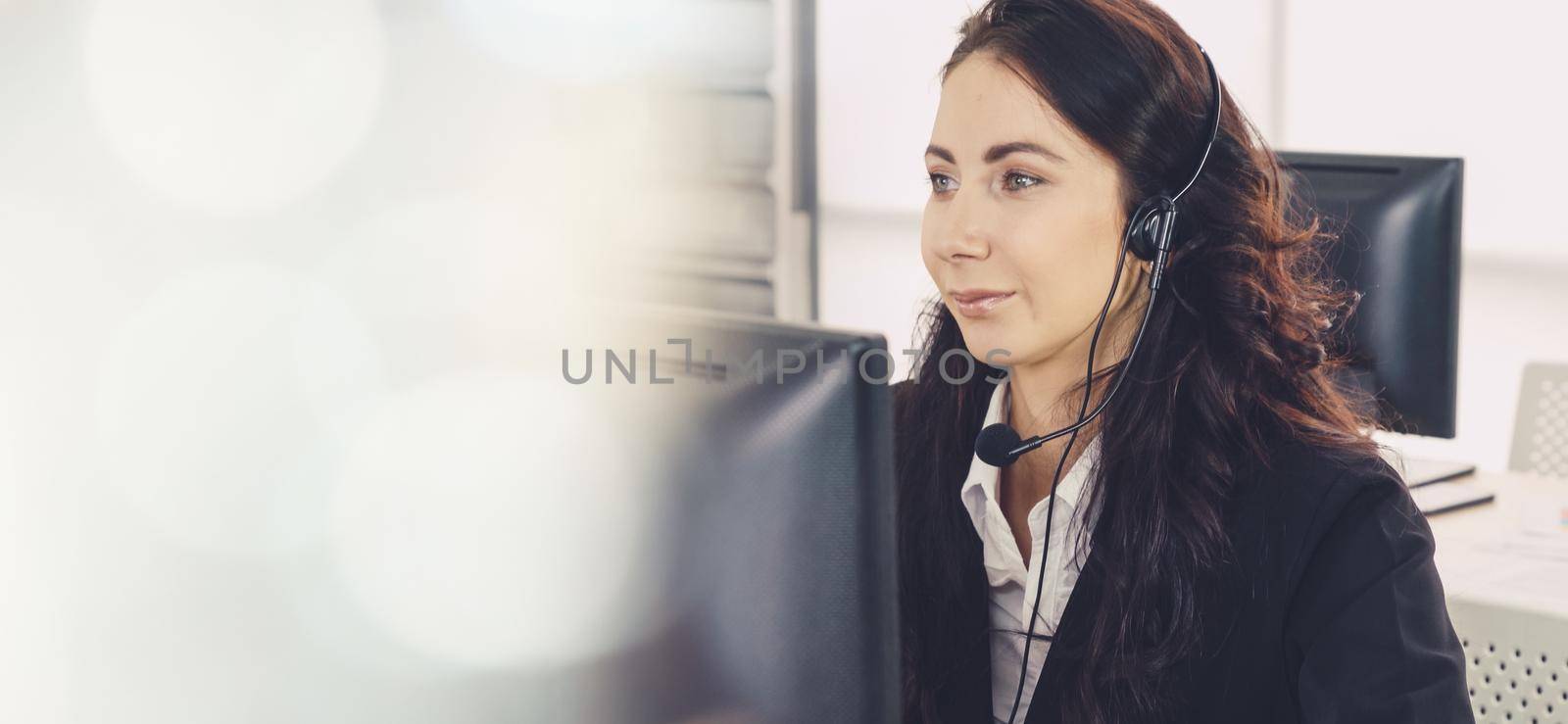 Business people wearing headset working in office to support remote customer or colleague. Call center, telemarketing, customer support agent provide service in broaden view .