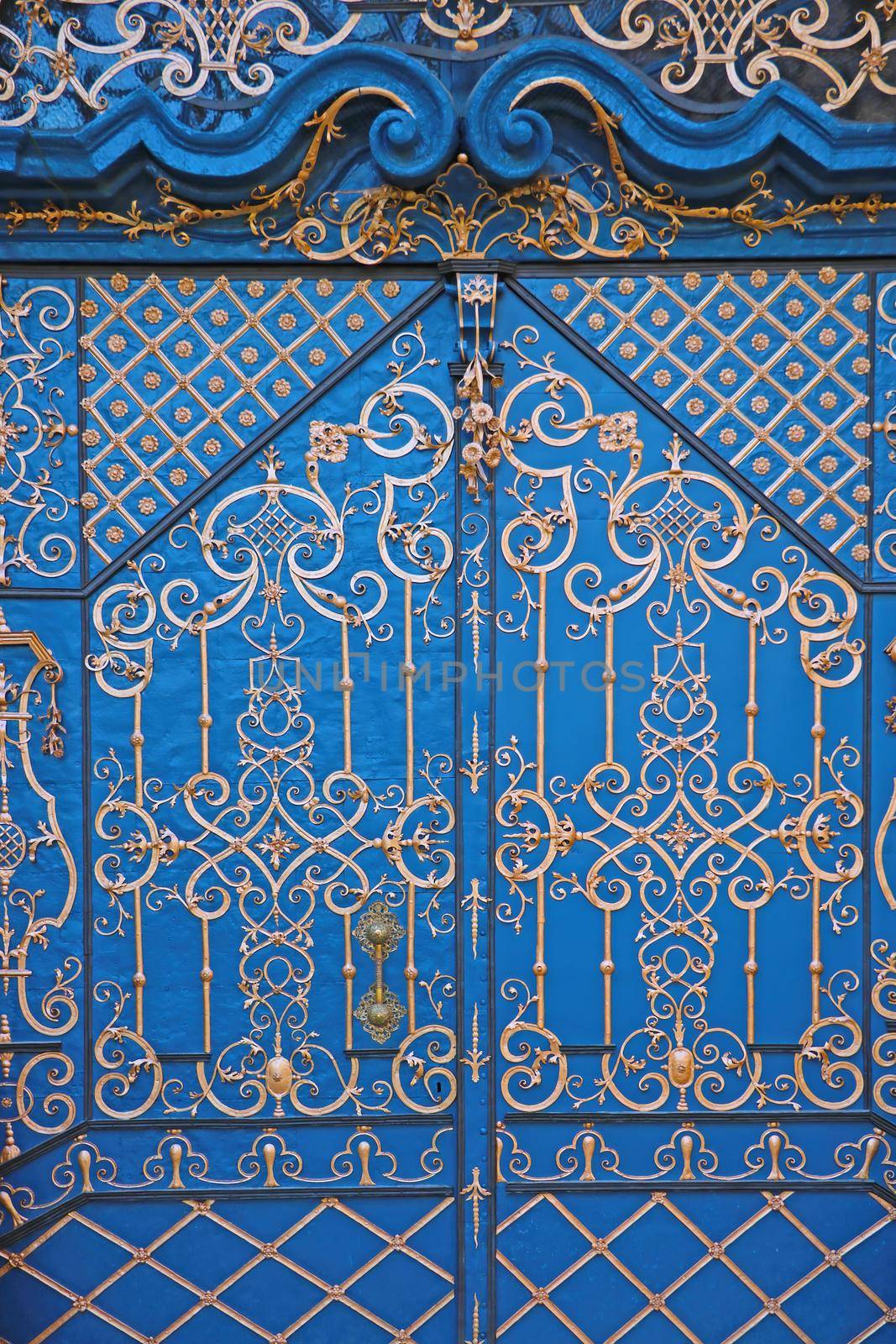 Beautiful blue old painted iron doors in the old part of the city