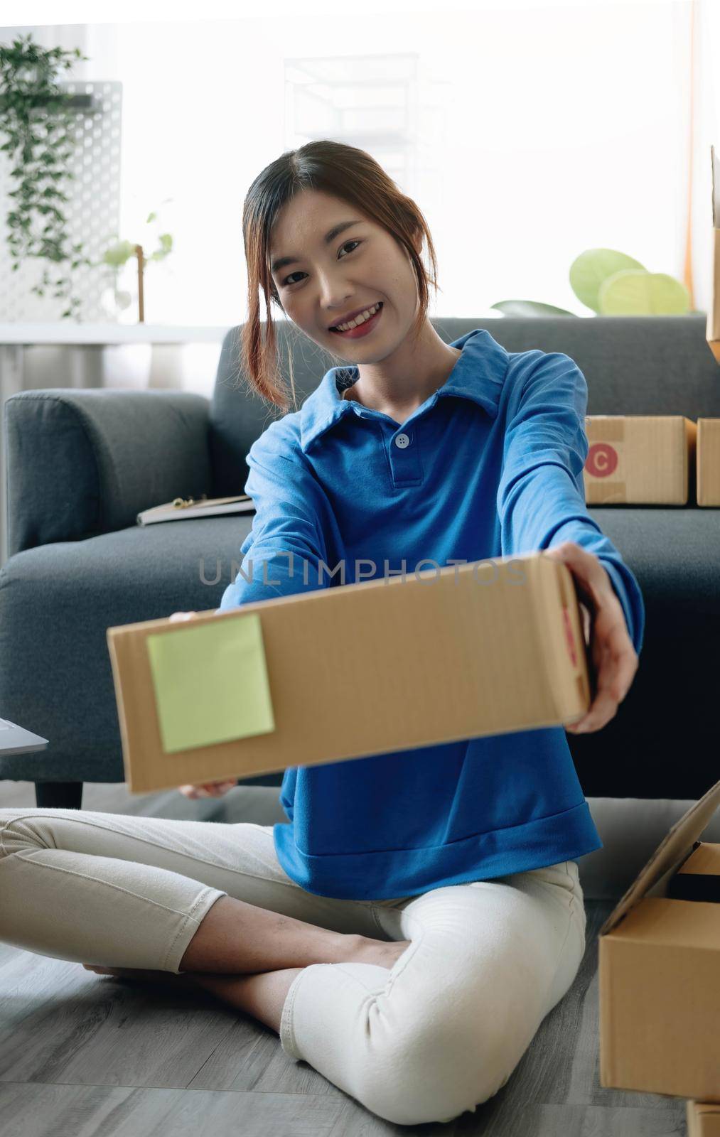 Portrait of Starting small businesses SME owners female entrepreneurs working on receipt box and check online orders to prepare to Sme pack the boxes, sell to customers, Sme business ideas online..