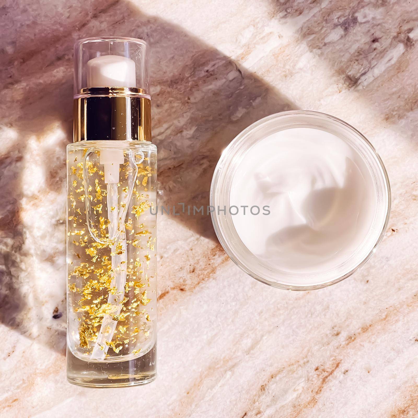 Skincare cosmetics, face cream moisturiser jar and golden serum emulsion in bottle, beauty product flatlay view