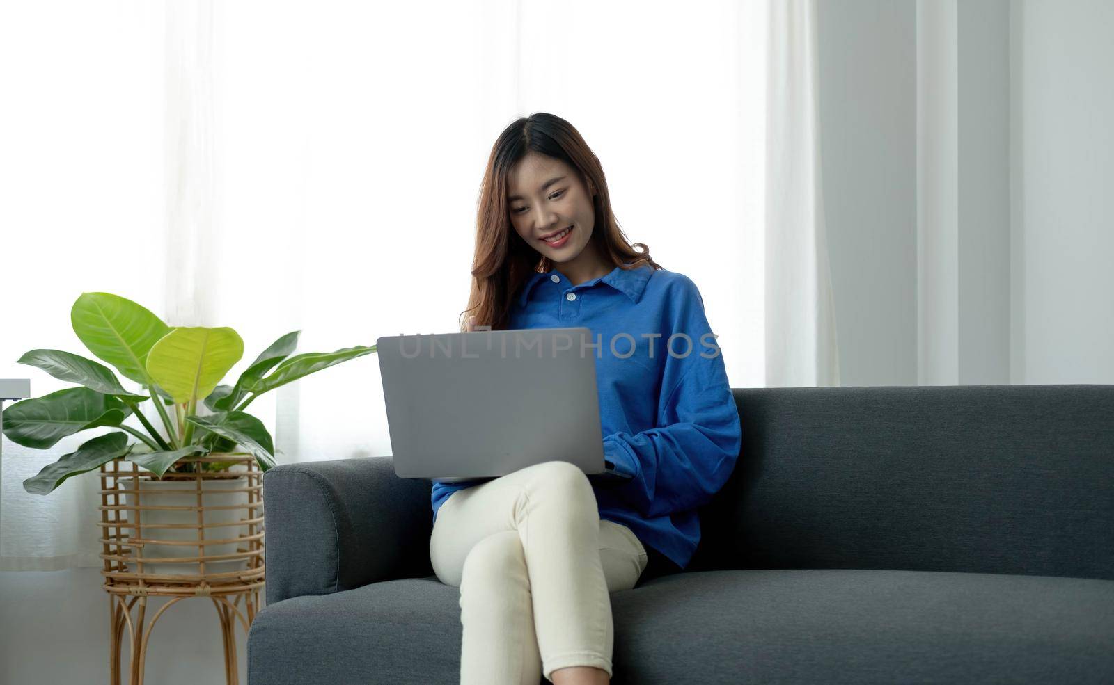 Recruitment Concept. Girl Browsing Work Opportunities Online, Using Job Search App or Website on Laptop by wichayada