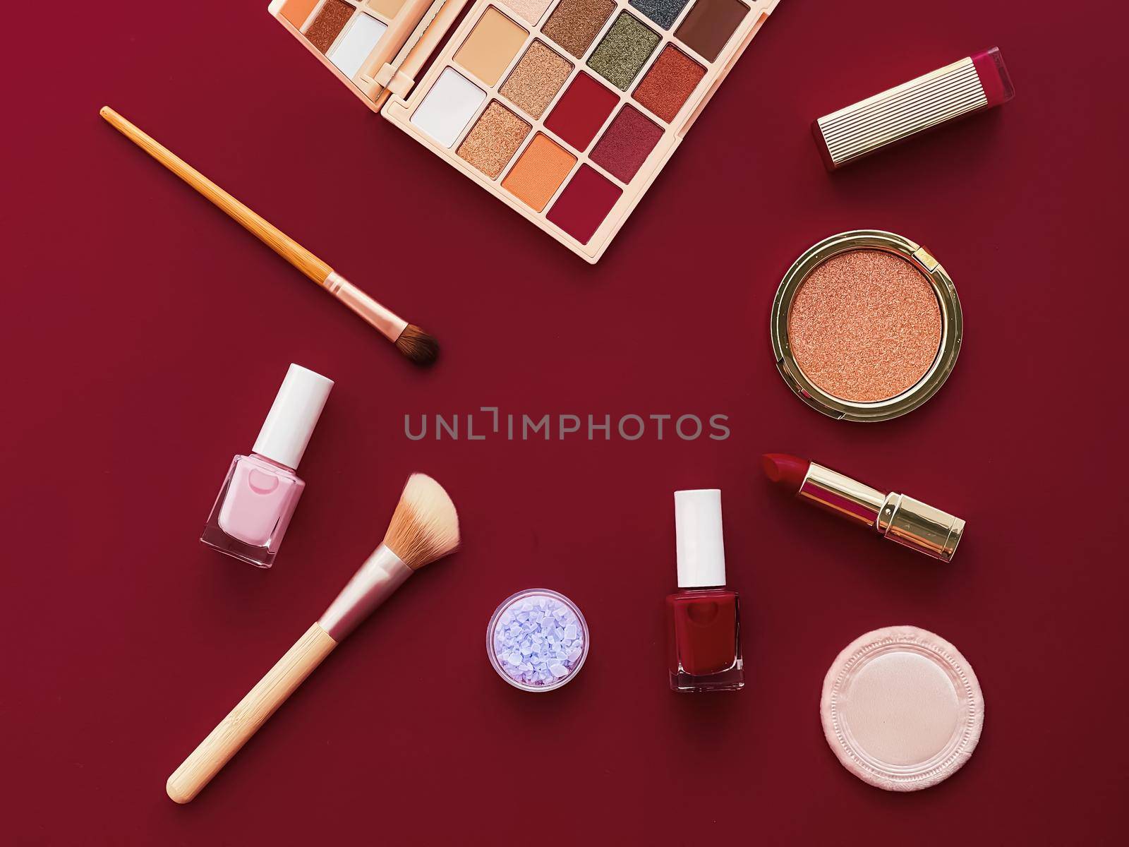 Beauty, make-up and cosmetics flatlay design with copyspace, cosmetic products and makeup tools on burgundy background, girly and feminine style by Anneleven