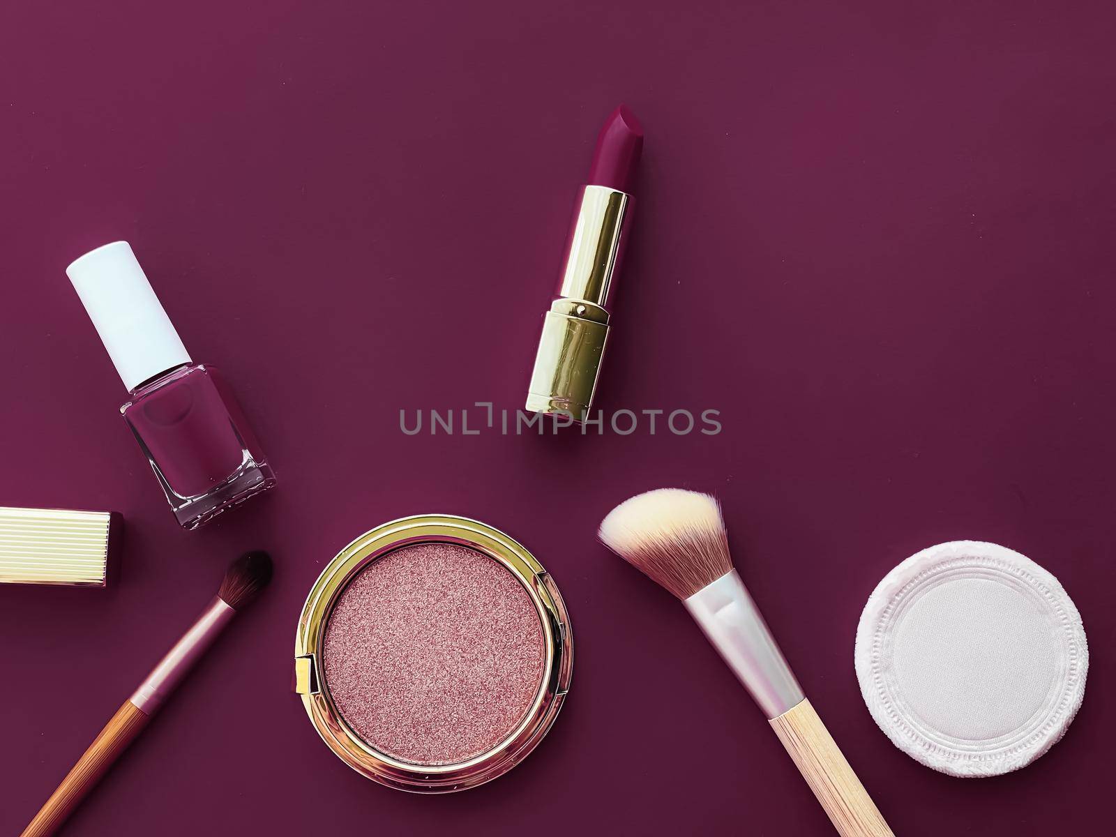 Beauty, make-up and cosmetics flatlay design with copyspace, cosmetic products and makeup tools on purple background, girly and feminine style concept