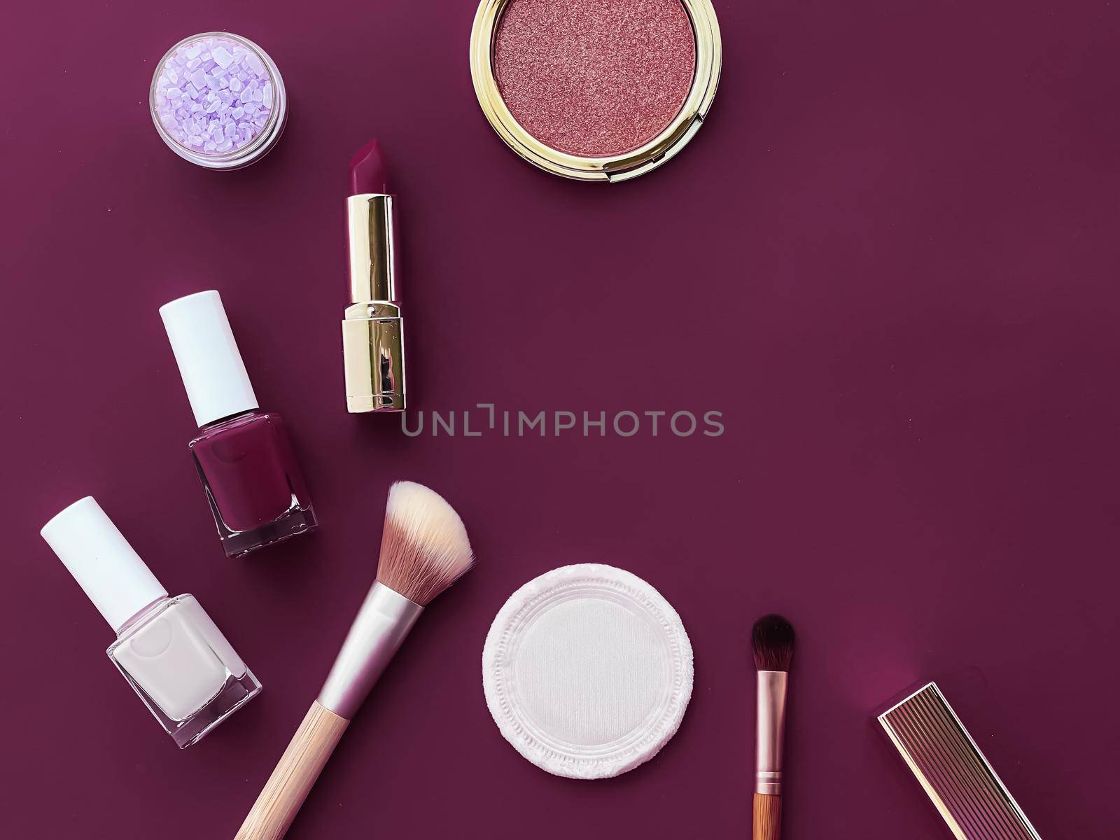 Beauty, make-up and cosmetics flatlay design with copyspace, cosmetic products and makeup tools on purple background, girly and feminine style concept