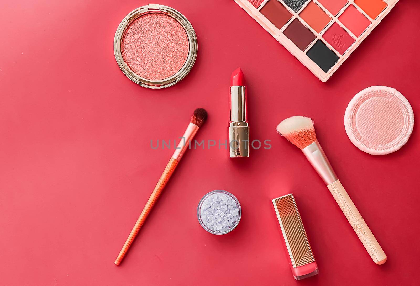 Beauty, make-up and cosmetics flatlay design with copyspace, cosmetic products and makeup tools on coral background, girly and feminine style concept