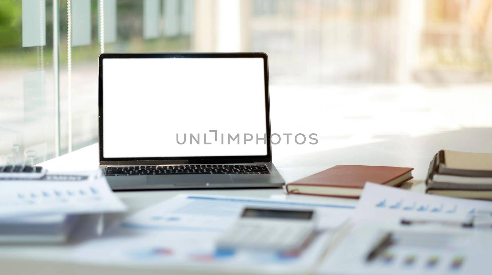 Laptop or notebook with blank screen on the floor service counter in the office. by wichayada