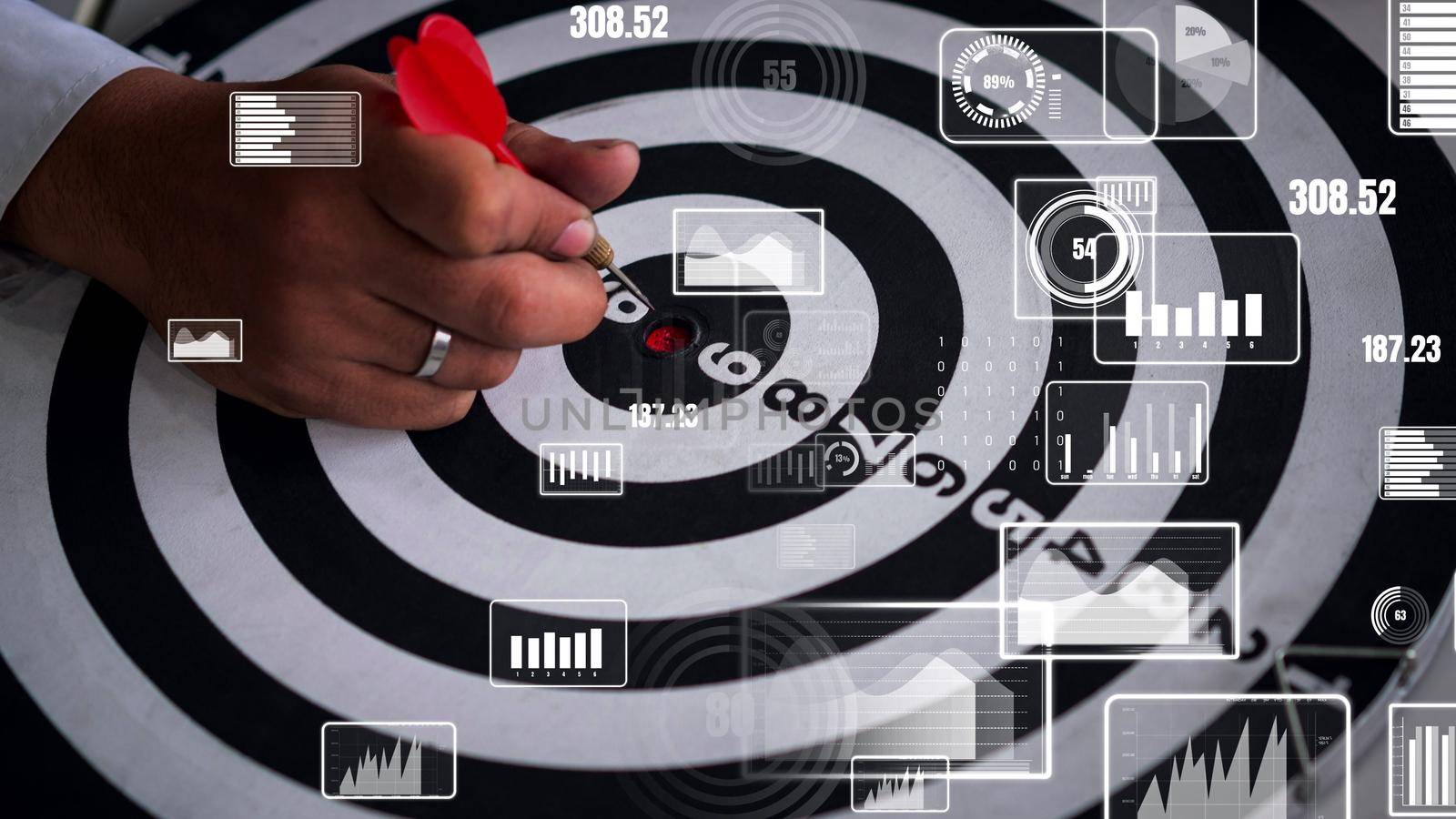 Businessman leader aiming at mission target. conceptual of challenge in business marketing bullseye and intelligent customer reach. The dart is strategy or skill. The dartboard is the project goal.