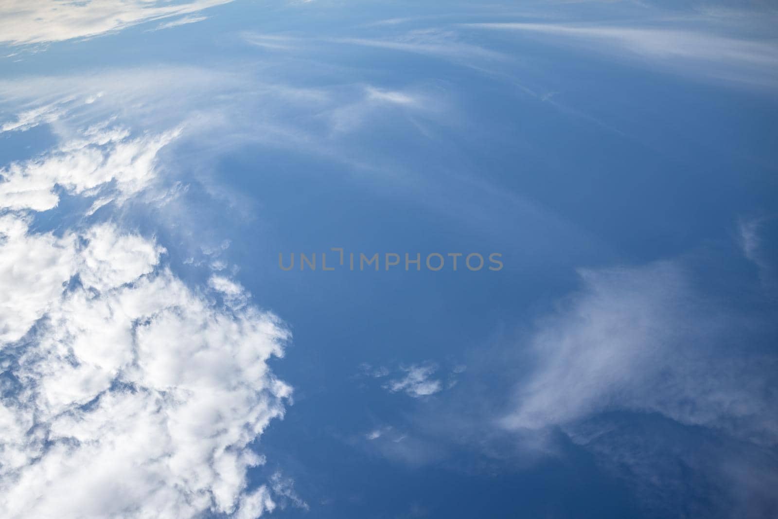 White clouds on the blue sky. Stratosphere.