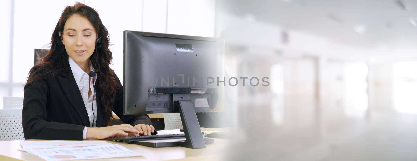 Business people wearing headset working in office broaden view by biancoblue