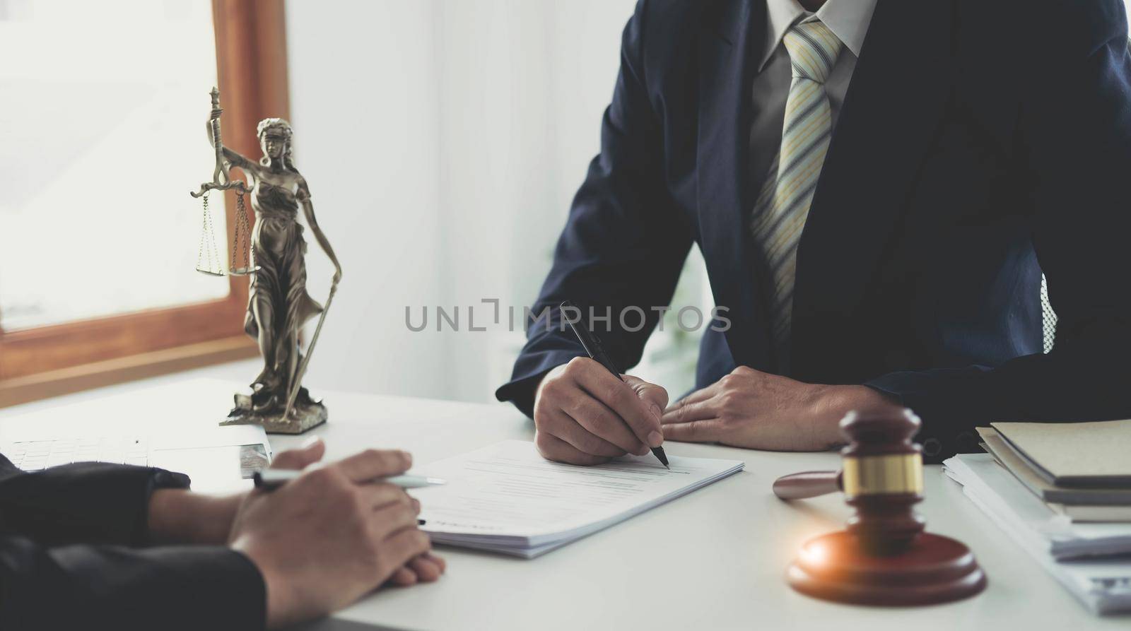 Businessman and lawyer discuss the contract document. Treaty of the law. Sign a contract business. by wichayada