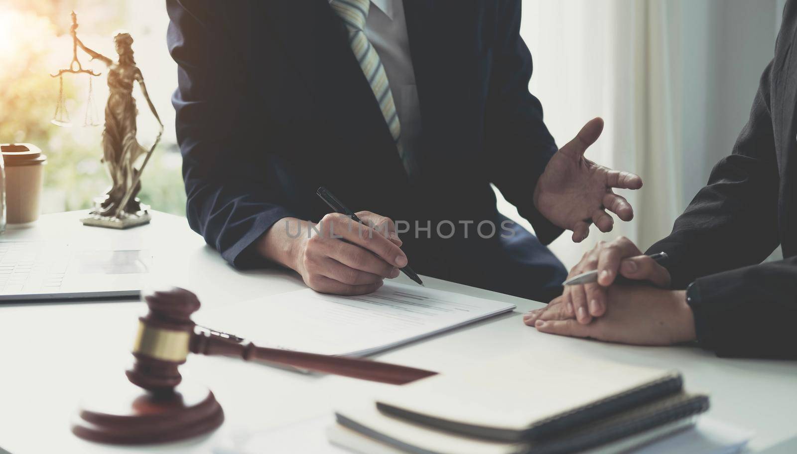Consultation and conference of Male lawyers and professional businesswoman working and discussion having at law firm in office. Concepts of law, Judge gavel with scales of justice..