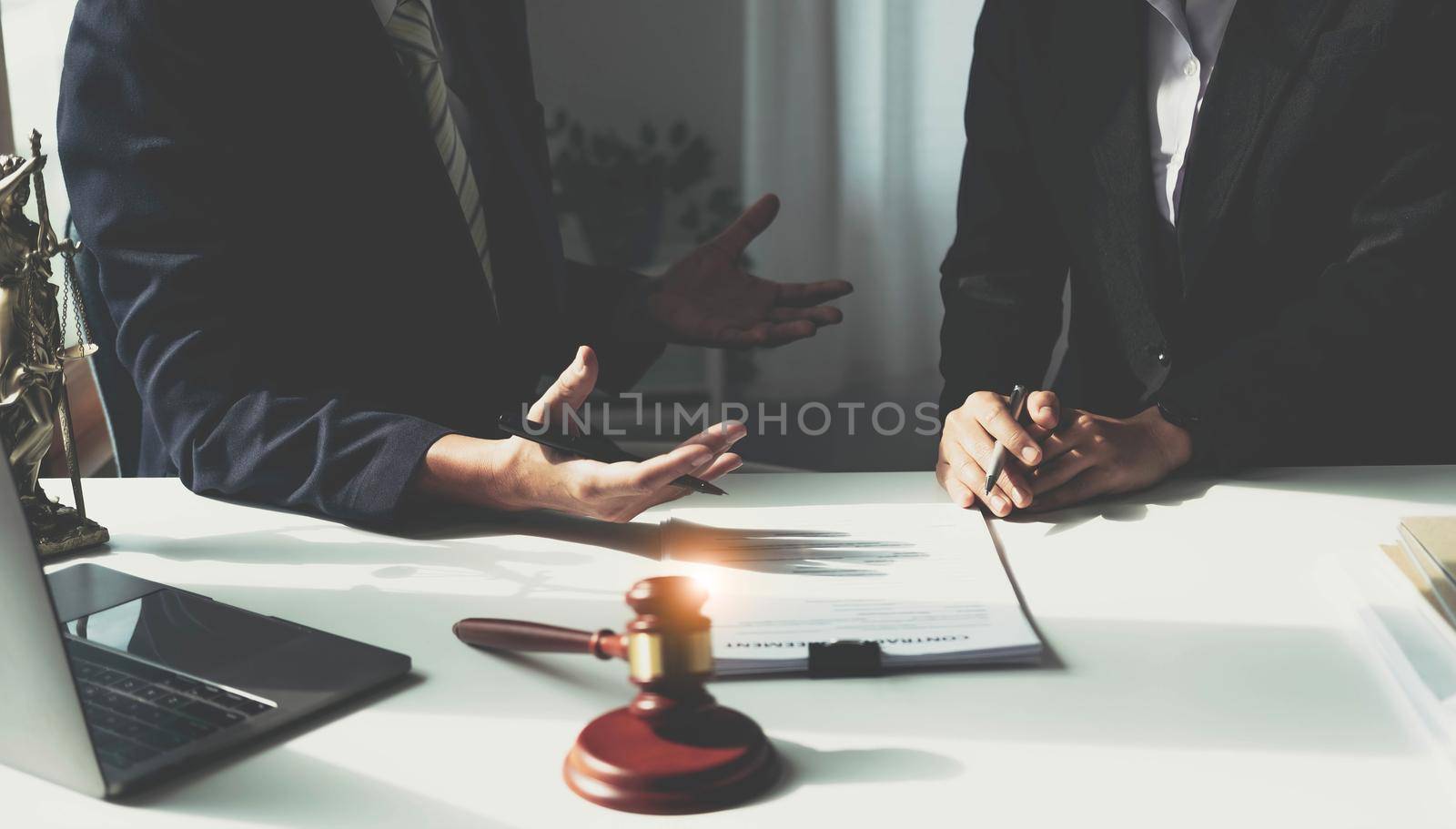 Good service cooperation, Consultation of Businesswoman and Male lawyer or judge counselor having team meeting with client, Law and Legal services concept. by wichayada