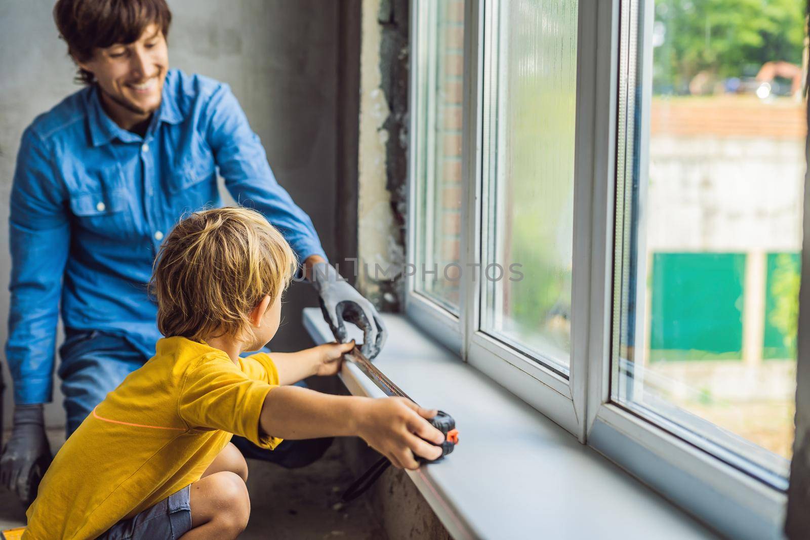 Father and son repair windows together. Repair the house yourself by galitskaya