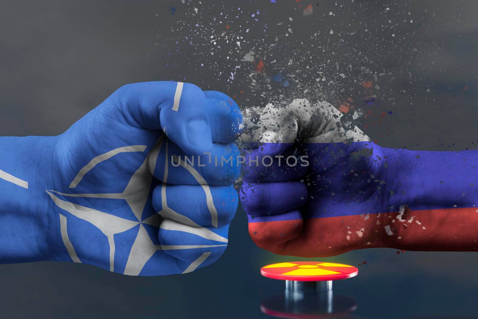 Confrontation NATO and Russia. Military conflict in Ukraine. The threat of nuclear war. NATO fist breaks a fist painted in the colors of the Russian flag. Red button with a symbol of nuclear weapons