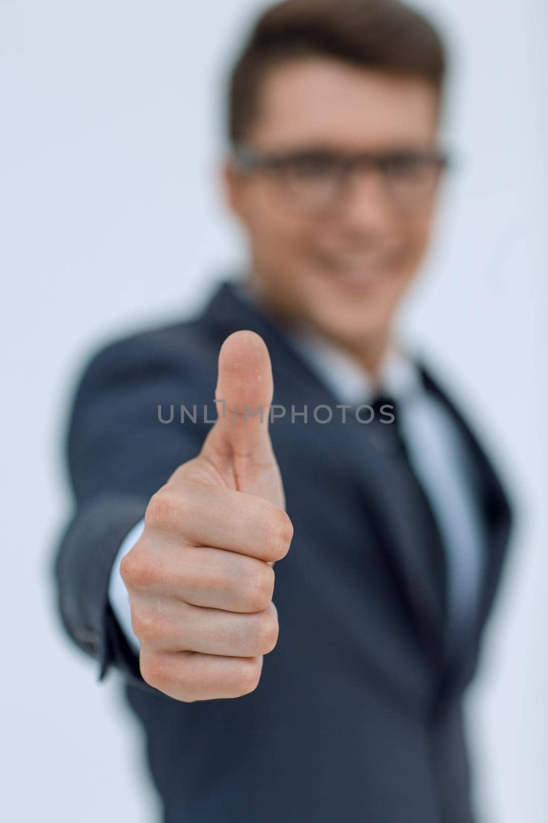 close up.modern businessman pointing at you.isolated on white background
