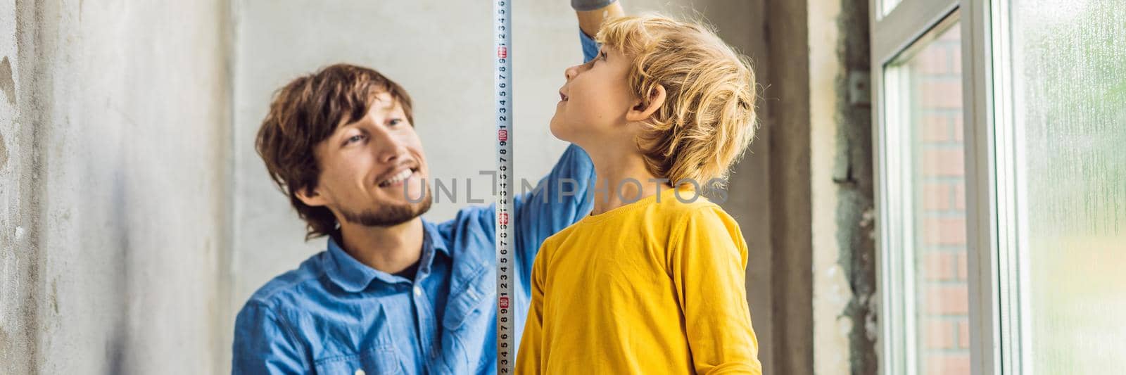 Father and son repair windows together. Repair the house yourself. BANNER, LONG FORMAT
