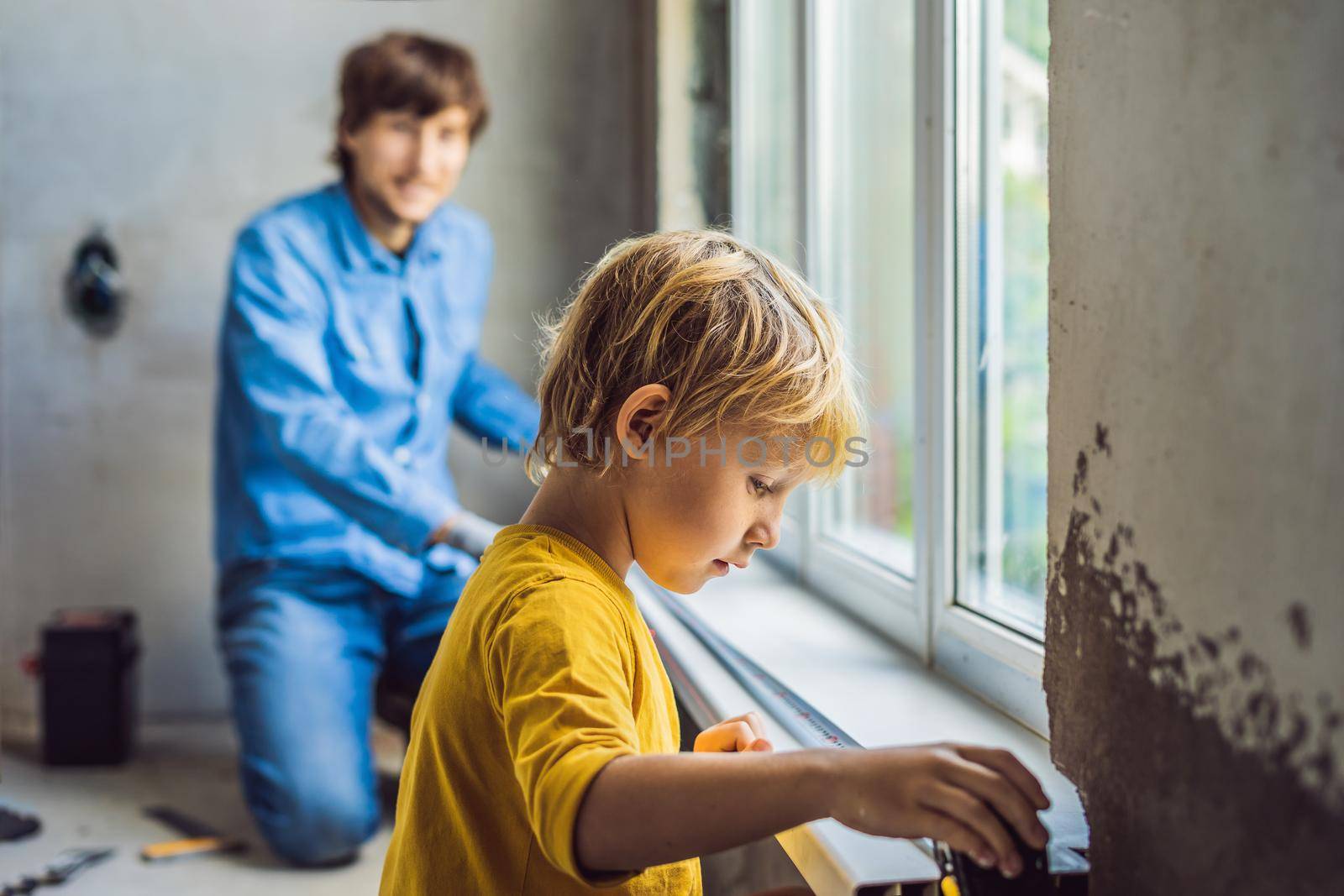 Father and son repair windows together. Repair the house yourself by galitskaya