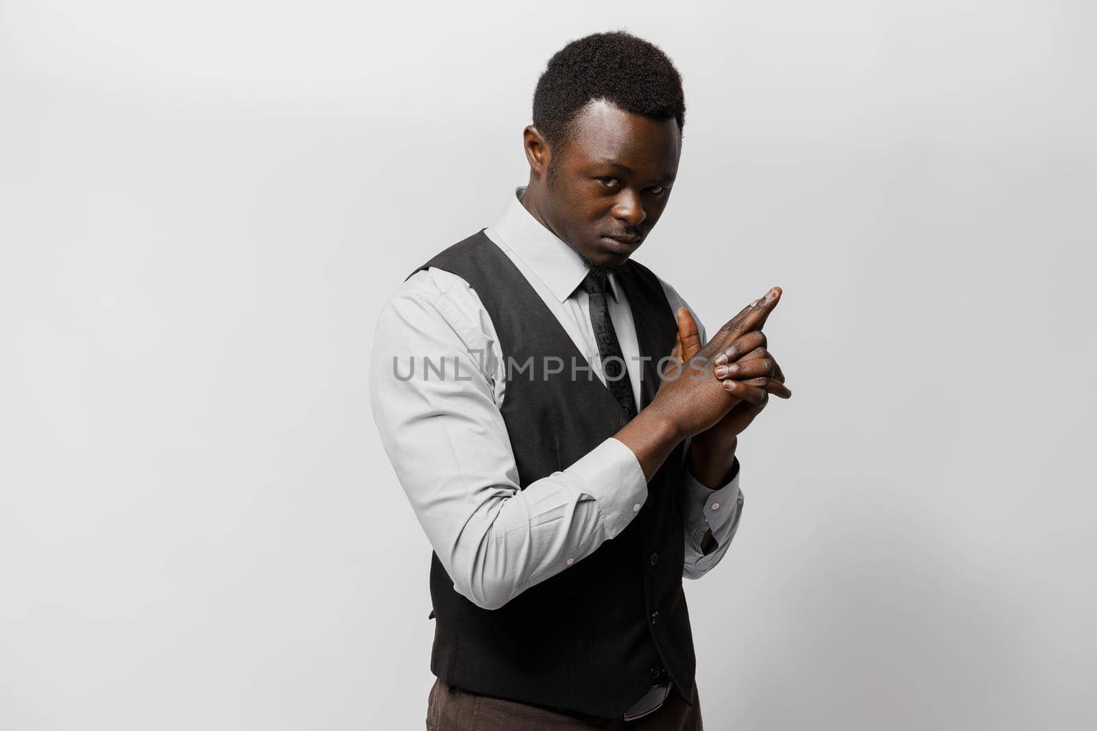 Online courses of native language by african man. Business portrait in studio on white background. Online business by Rabizo