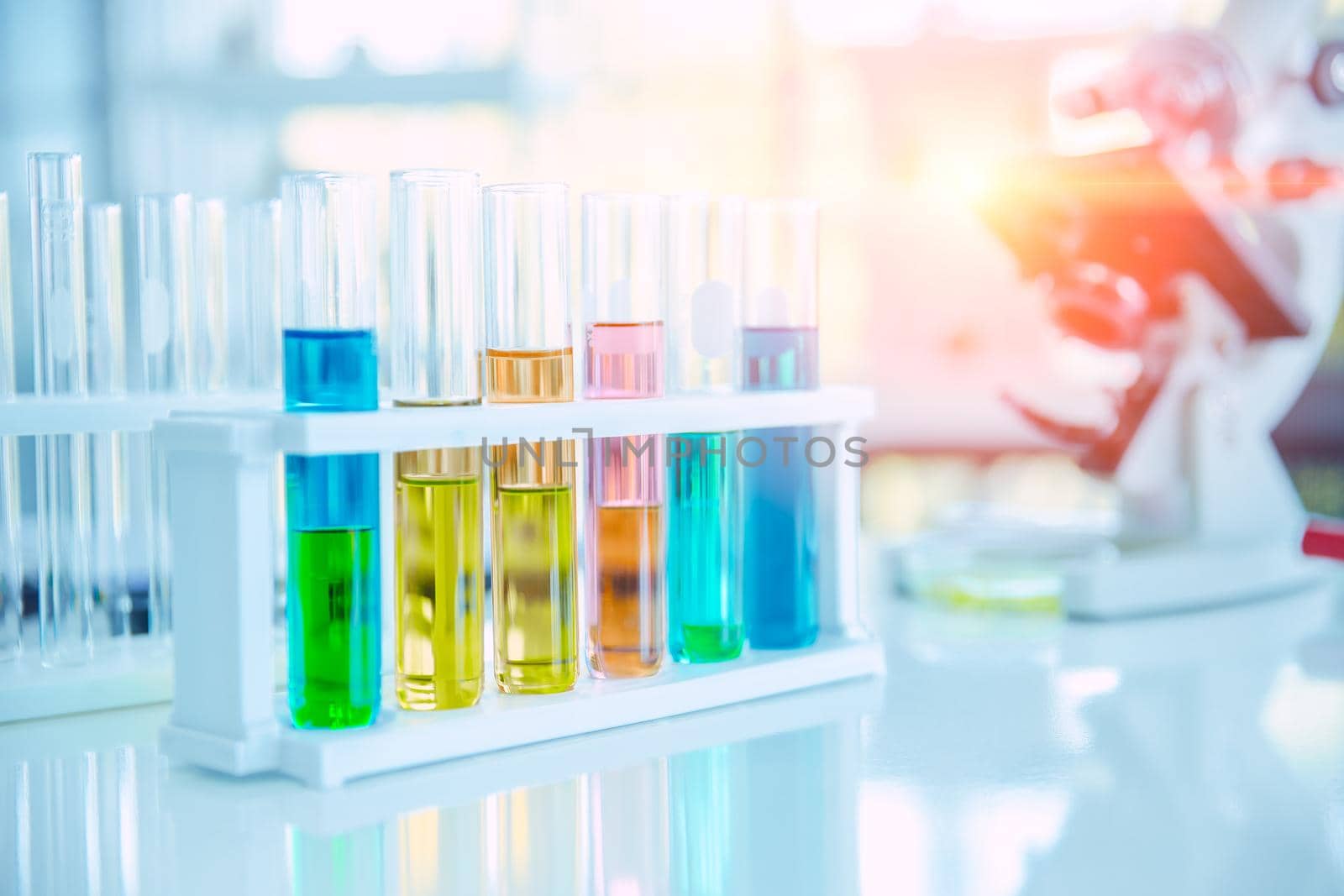 Science lab chemical solution in test tube for medical industry background.