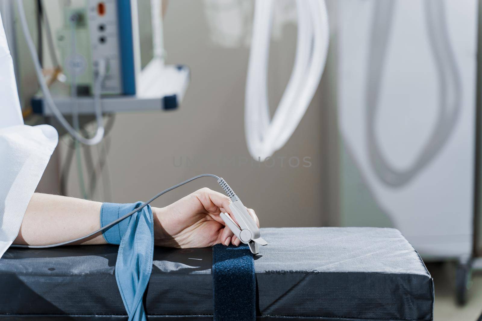 Pulse oximeter on woman hand for measuring oxygen saturation