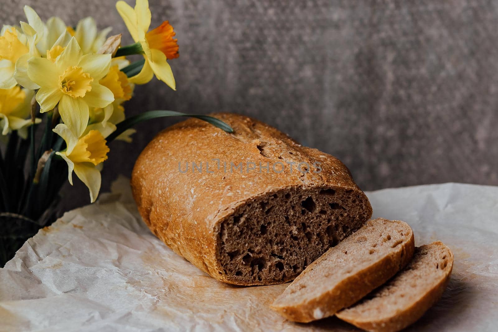 Sliced rye bread on cutting board. Whole grain rye bread with seeds.