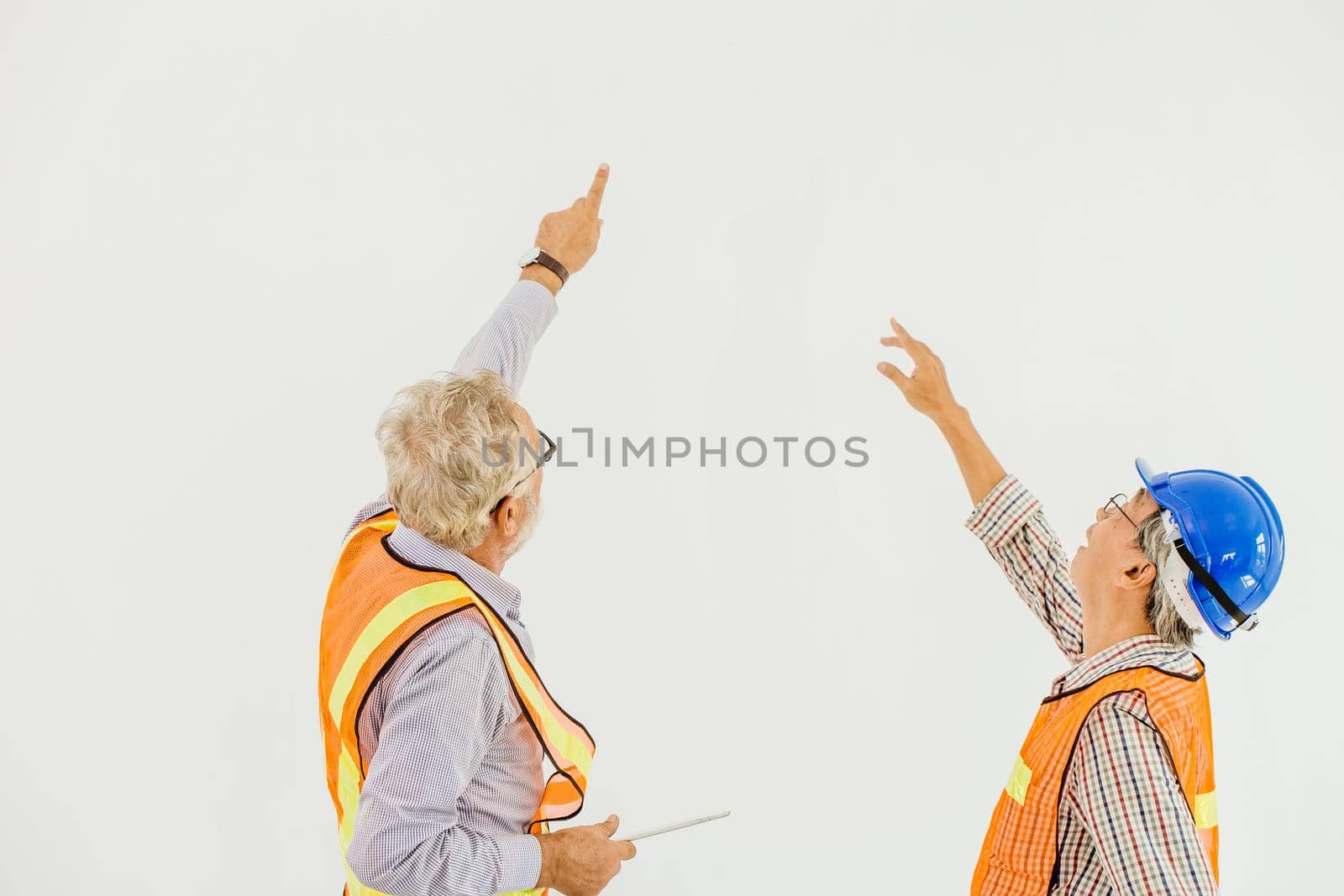 Professional builder working together inspect the ceiling to improve renovate building by qualitystocks