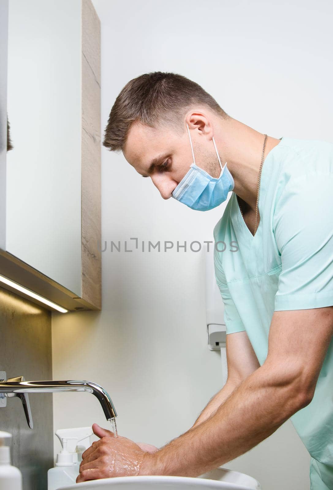 Nurse is washing his hands. Disinfecting method with water and soap to stop coronavirus covid 19.