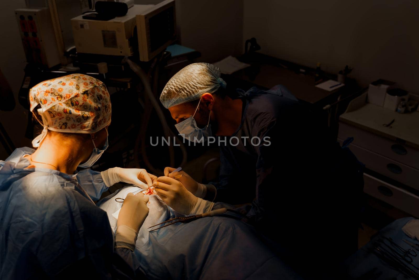 Blepharoplasty plastic surgery operation for modifying the eye region of the face in medical clinic. Surgeon makes an incision with a surgical knife