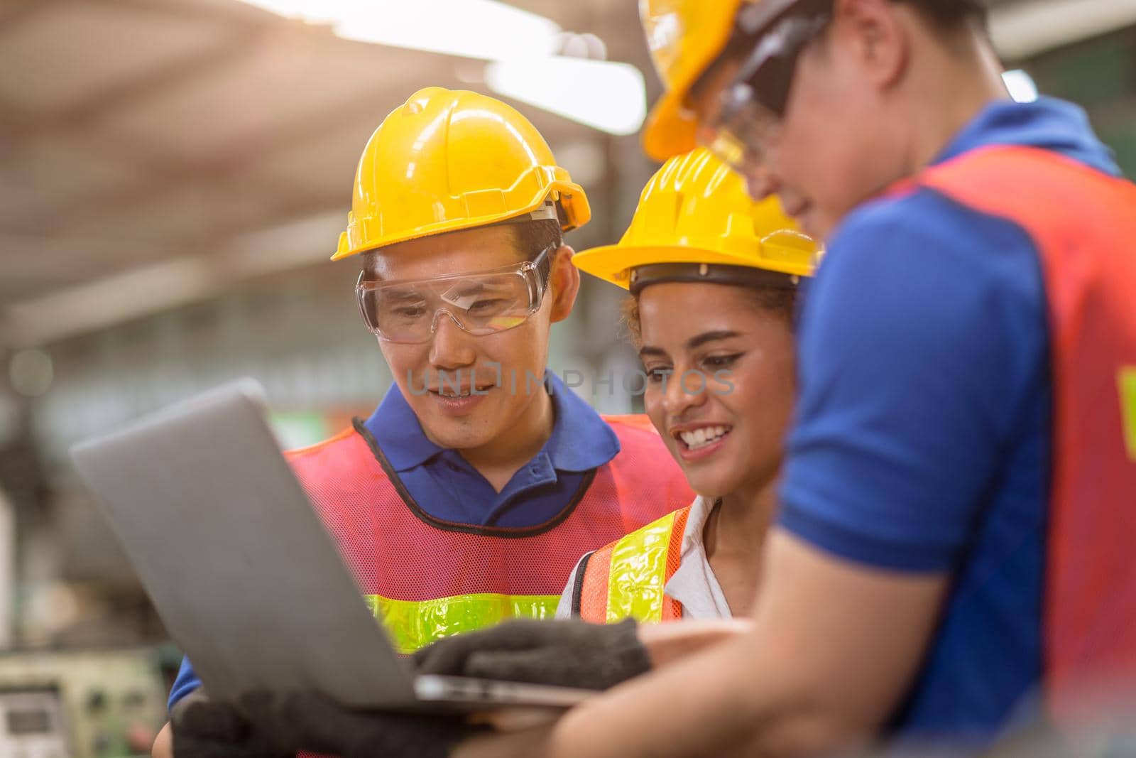 engineer women working with male team mix race work help together in heavy industry with laptop computer discussion, join partner good teamwork.