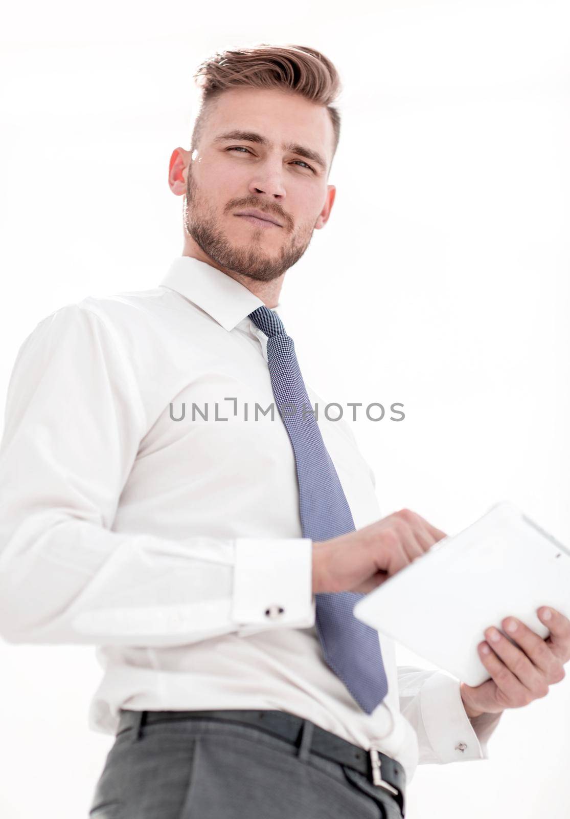 close up.modern business man with a digital tablet by asdf
