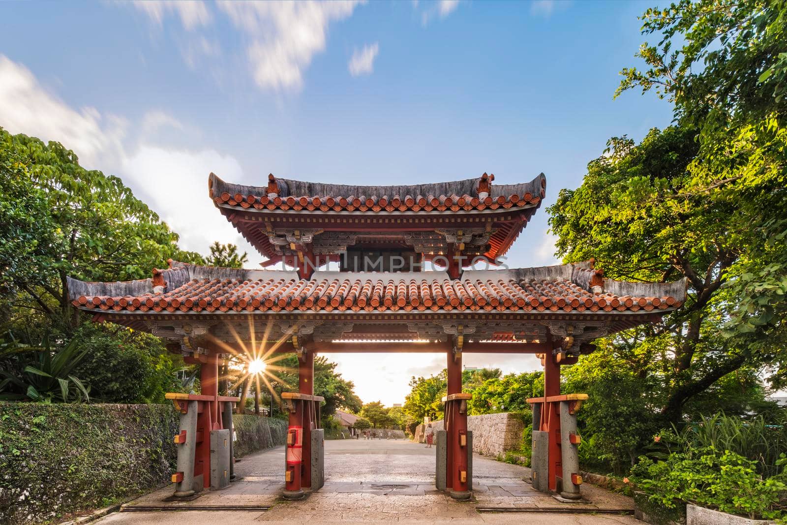 The Shureimon gate of Shuri Castle in Okinawa at sunset. by kuremo