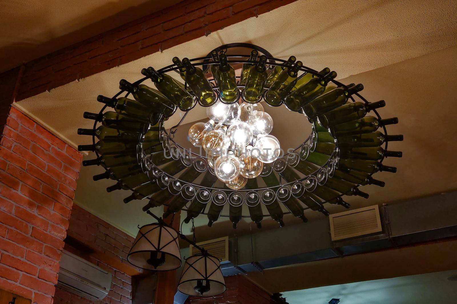 Beautifully decorated bottle chandelier in a bar or restaurant