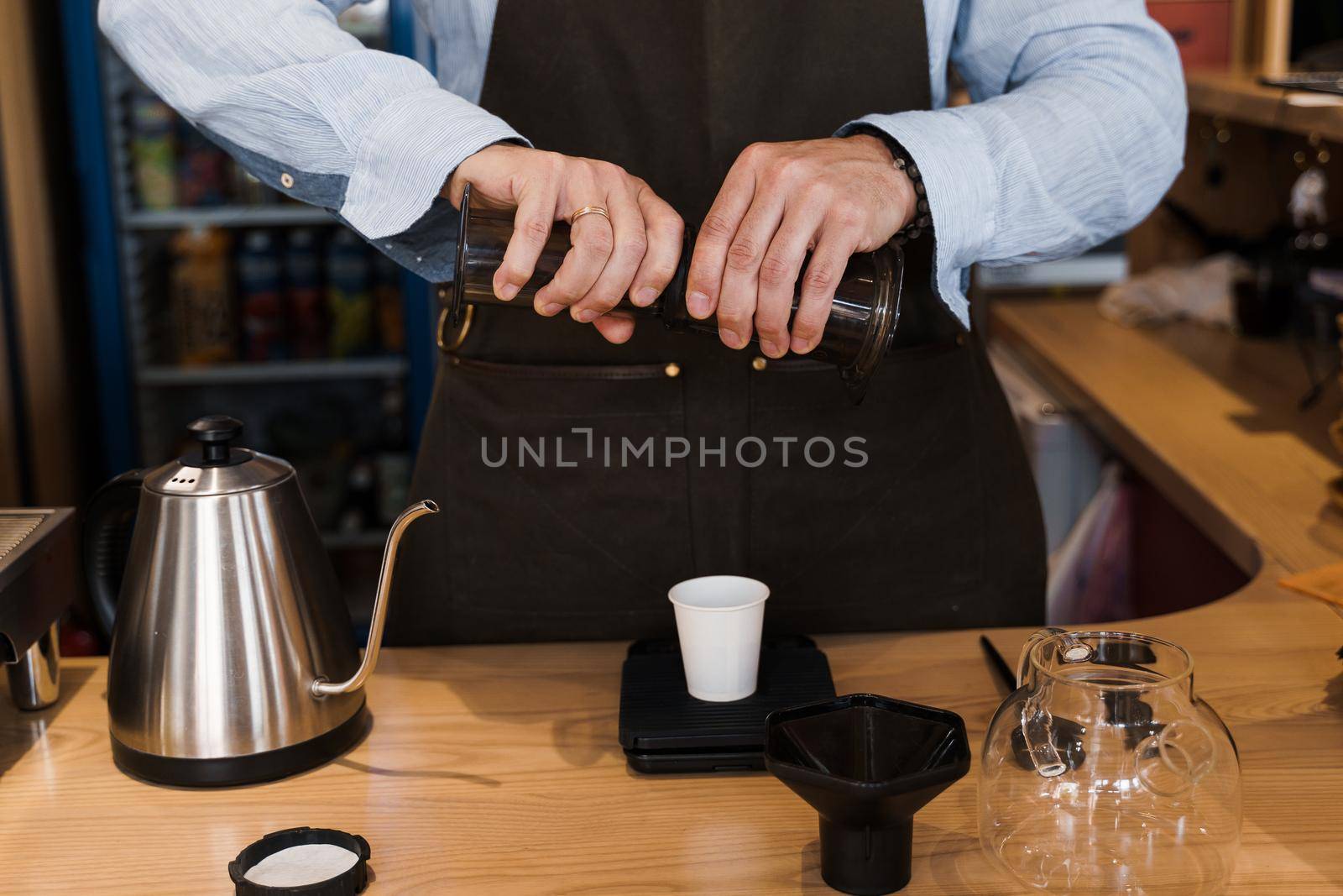 Aeropress coffee alternative making by barista in the cafe. Barista connect details from aeropress together. prepare aeropress to pour it