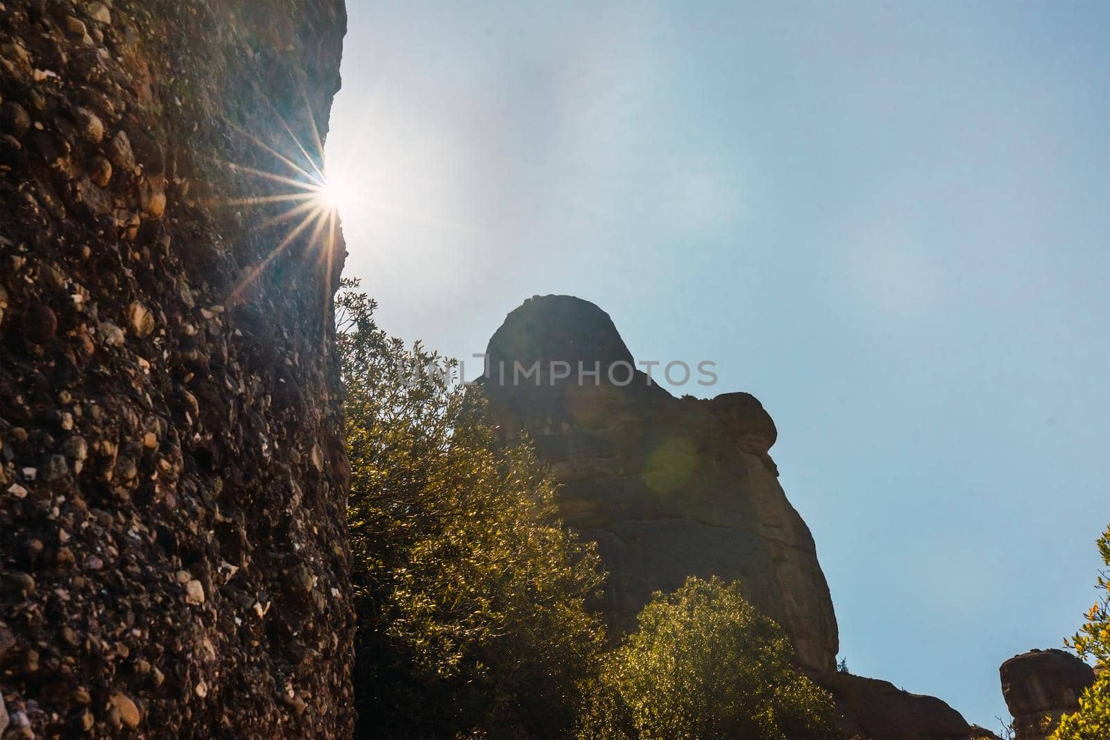 Mountain landscape, sunlit forest and blue sky. Mountain of Montserrat Spain. Mediterranean forest. warm weather, spring or summer season. holiday resort.