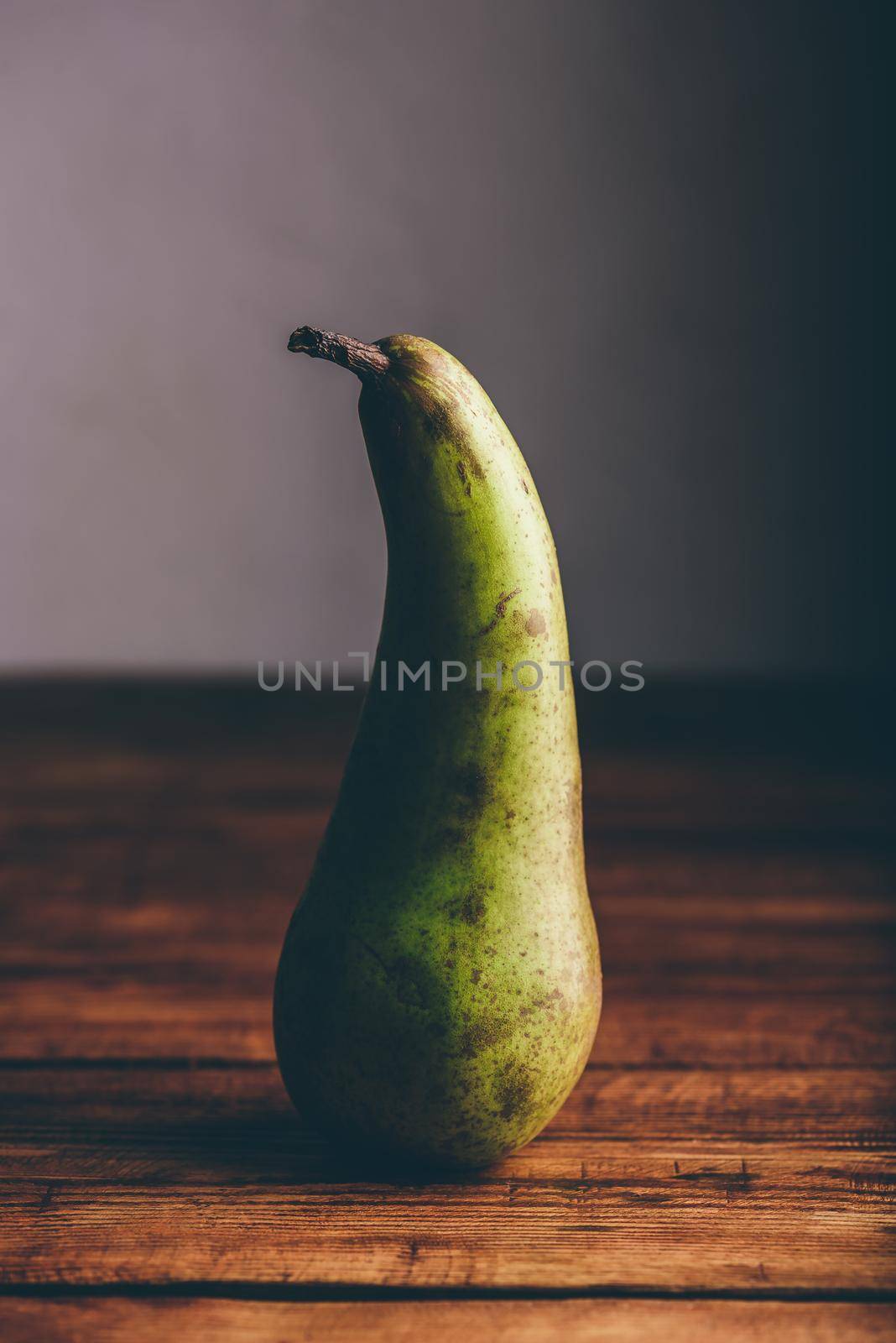 Still Life with Conference Pear on Wooden Tabletop