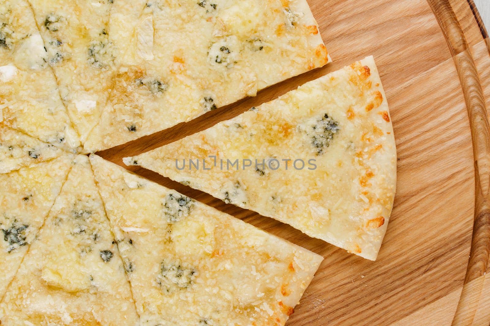 Pizza top view cutted on 8 pieces and one pushed forward. Advert for pizzeria caffee and restaurant. Food delivery at quarantine covid-19 concept.